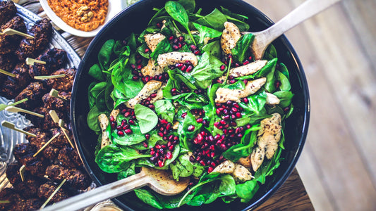Colorful salad ingredients in a bowl on a light table