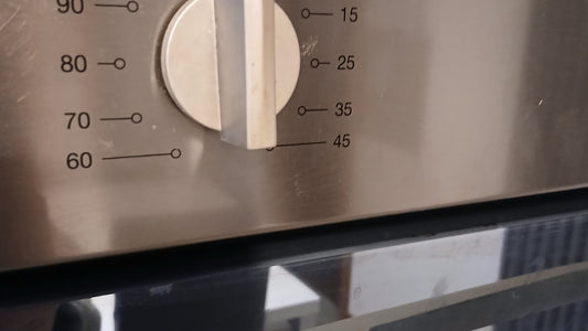 A close-up of a kitchen timer dial for a simple movement cue.