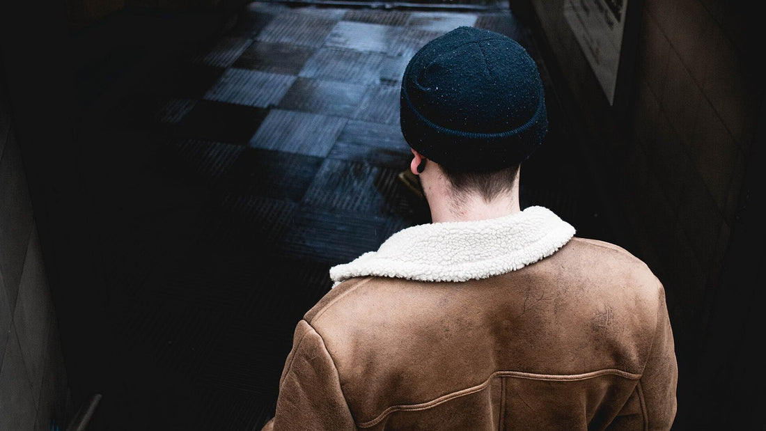 Person walking down stairs in a simple everyday setting