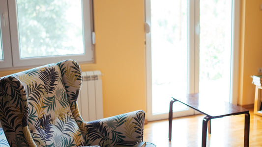 Cozy armchair beside a sunlit window in a living room