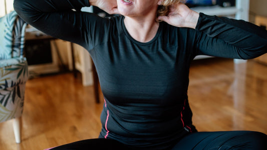 Person stretching in a bright living room