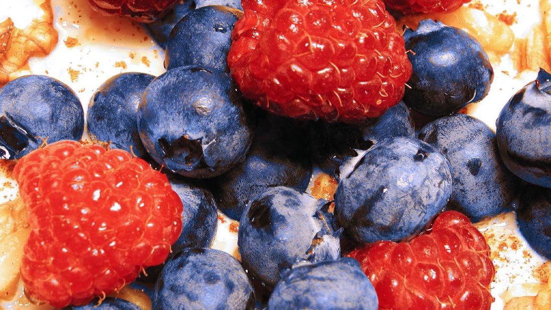 Bowl of oatmeal with berries and seeds on a table