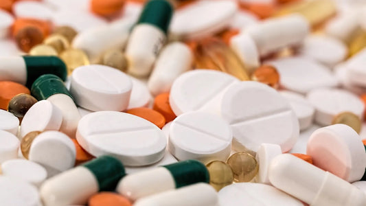 Assorted unbranded capsules and tablets in a close-up photo