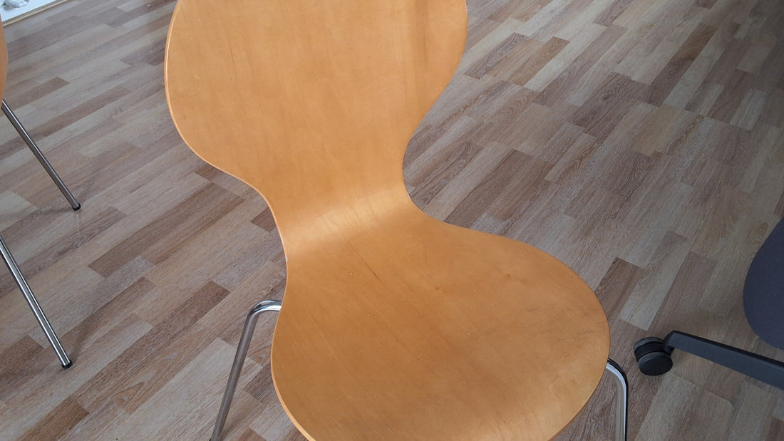 A plain wooden chair on a wood floor ready for a seated movement break