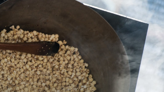 A bowl of pumpkin seeds and simple whole-food ingredients on a table